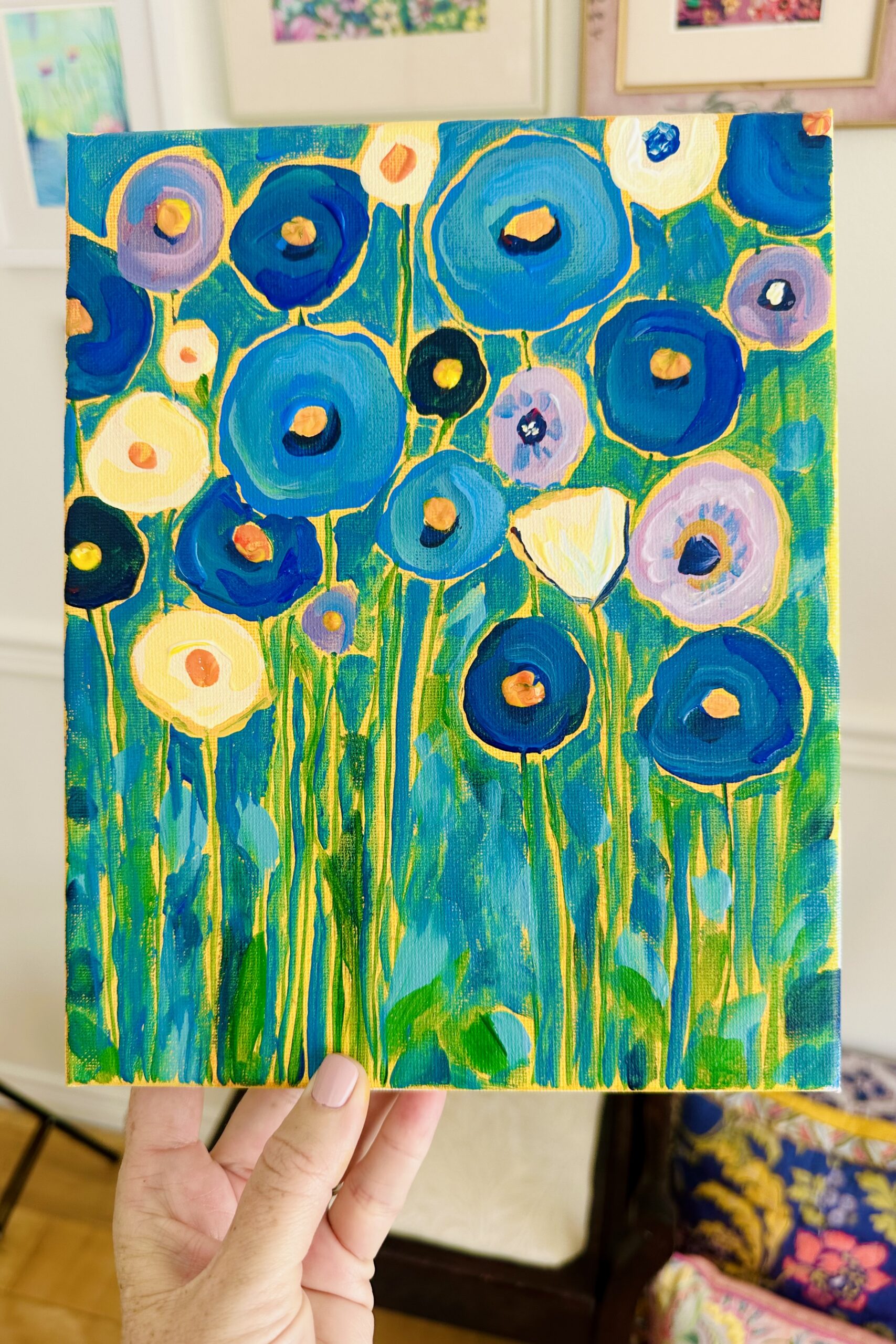 A decorative, mosaic-style acrylic painting of blue flowers and golden patterns in the style of Gustav Klimt.